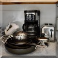 K01. Coffee maker, toasters, pots and pans. 